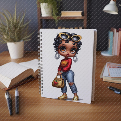 Notebook with a cartoon character on a desk with stationery items