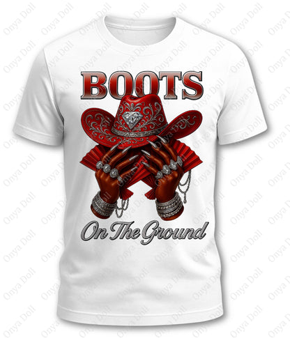 White t-shirt with red cowboy boots and hat graphic and 'Boots On The Ground' text on a white background