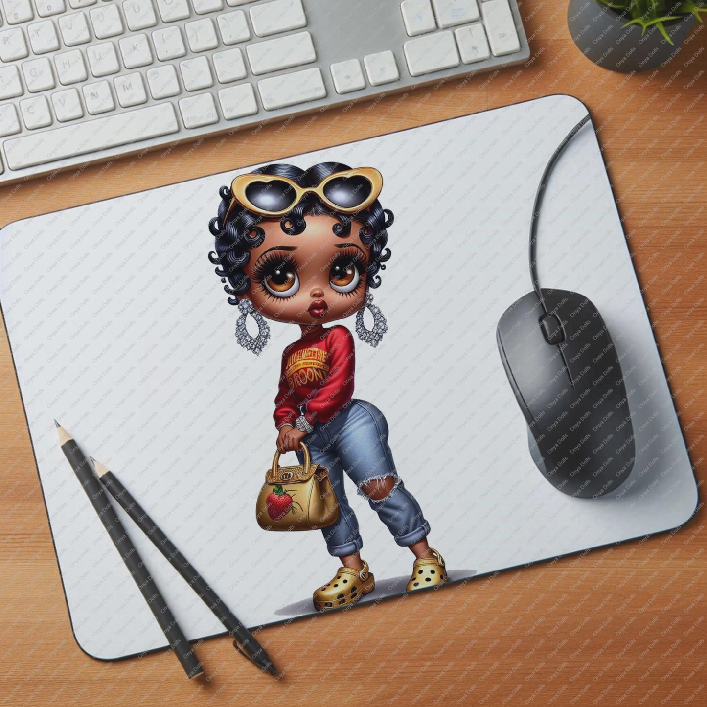 Mouse pad with a cartoon character on a desk with a keyboard and mouse.